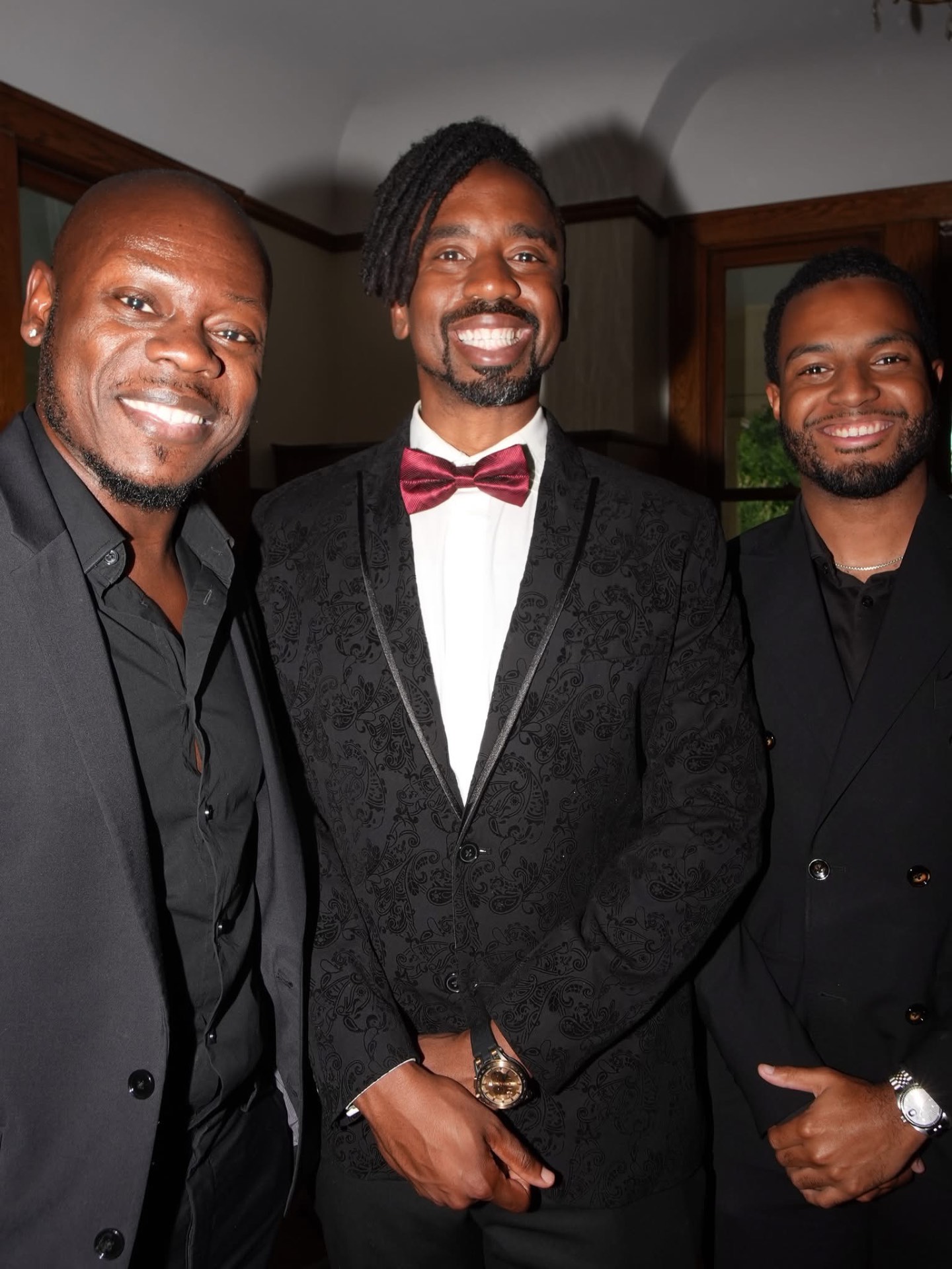 Davon at a formal event with pastors and friends